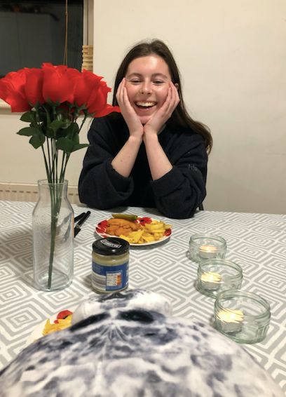 Image may contain: Flower Arrangement, Chair, Female, Face, Food, Dish, Meal, Tabletop, Flower, Blossom, Plant, Dining Table, Table, Furniture, Human, Person
