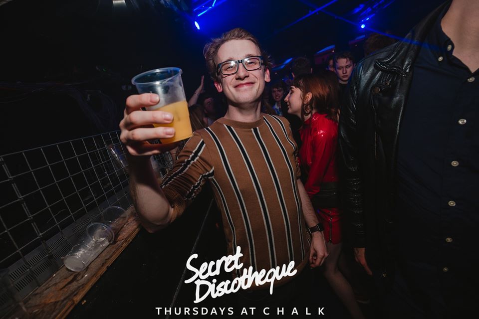 Image may contain: Night Club, Club, Accessories, Accessory, Glasses, Beverage, Alcohol, Drink, Beer, Person, Human