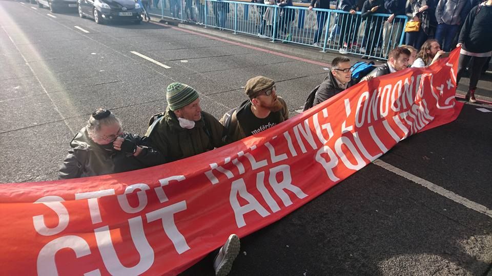 Image may contain: Parade, Crowd, Text, Banner, Person, People, Human