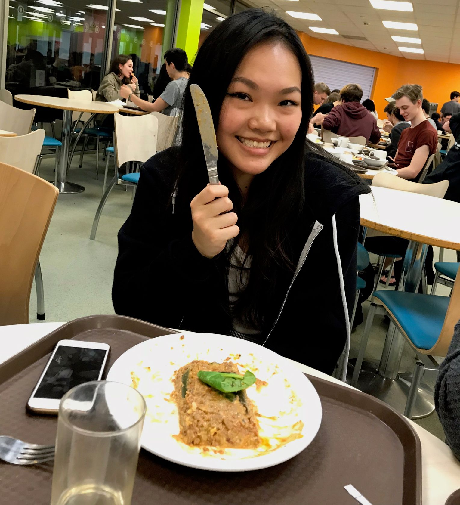 Image may contain: Restaurant, Food Court, Food, Room, Indoors, Classroom, Furniture, Chair, Person, People, Human