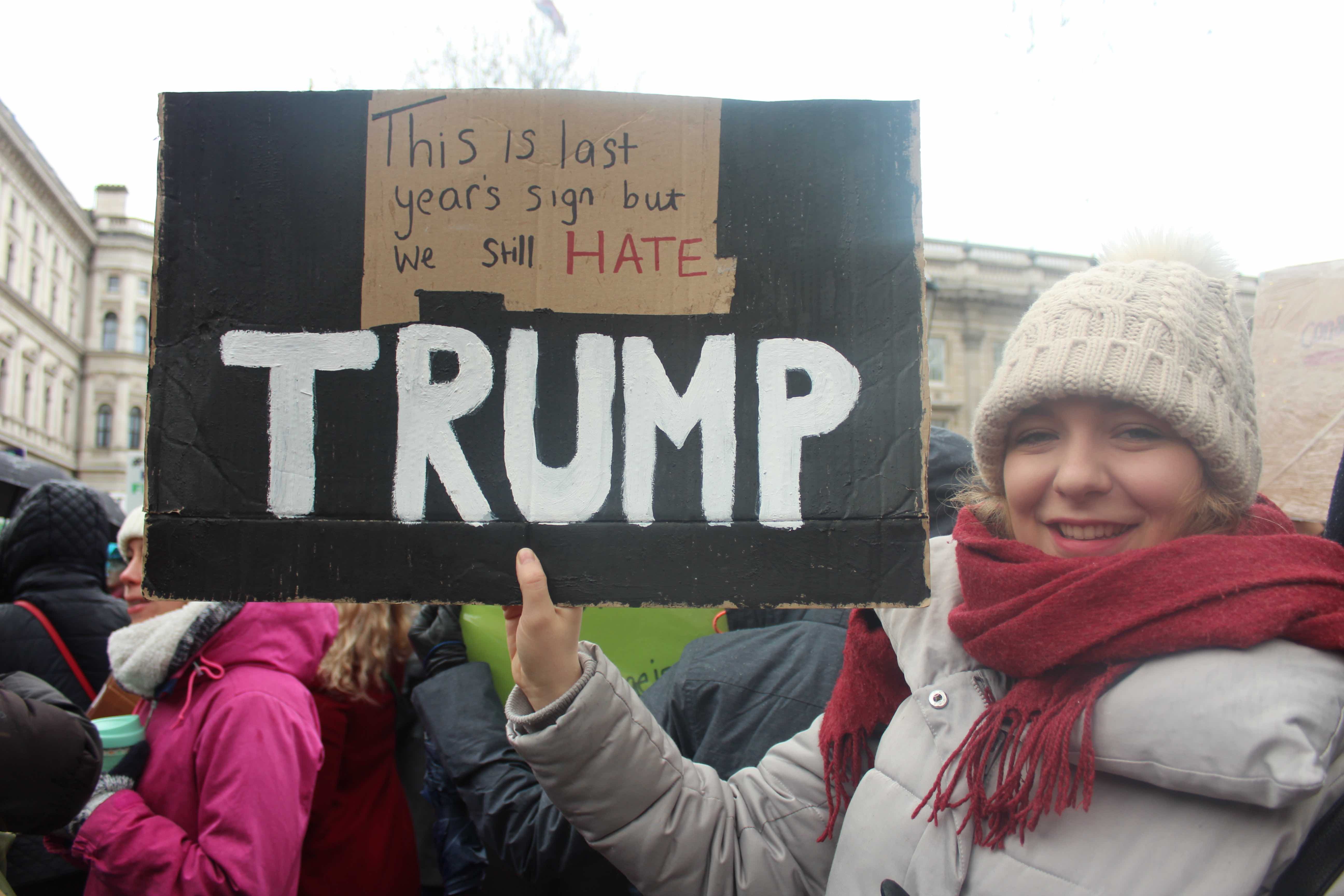 Image may contain: Scarf, Clothing, Parade, Text, Sticker, Label, Crowd, Person, People, Human