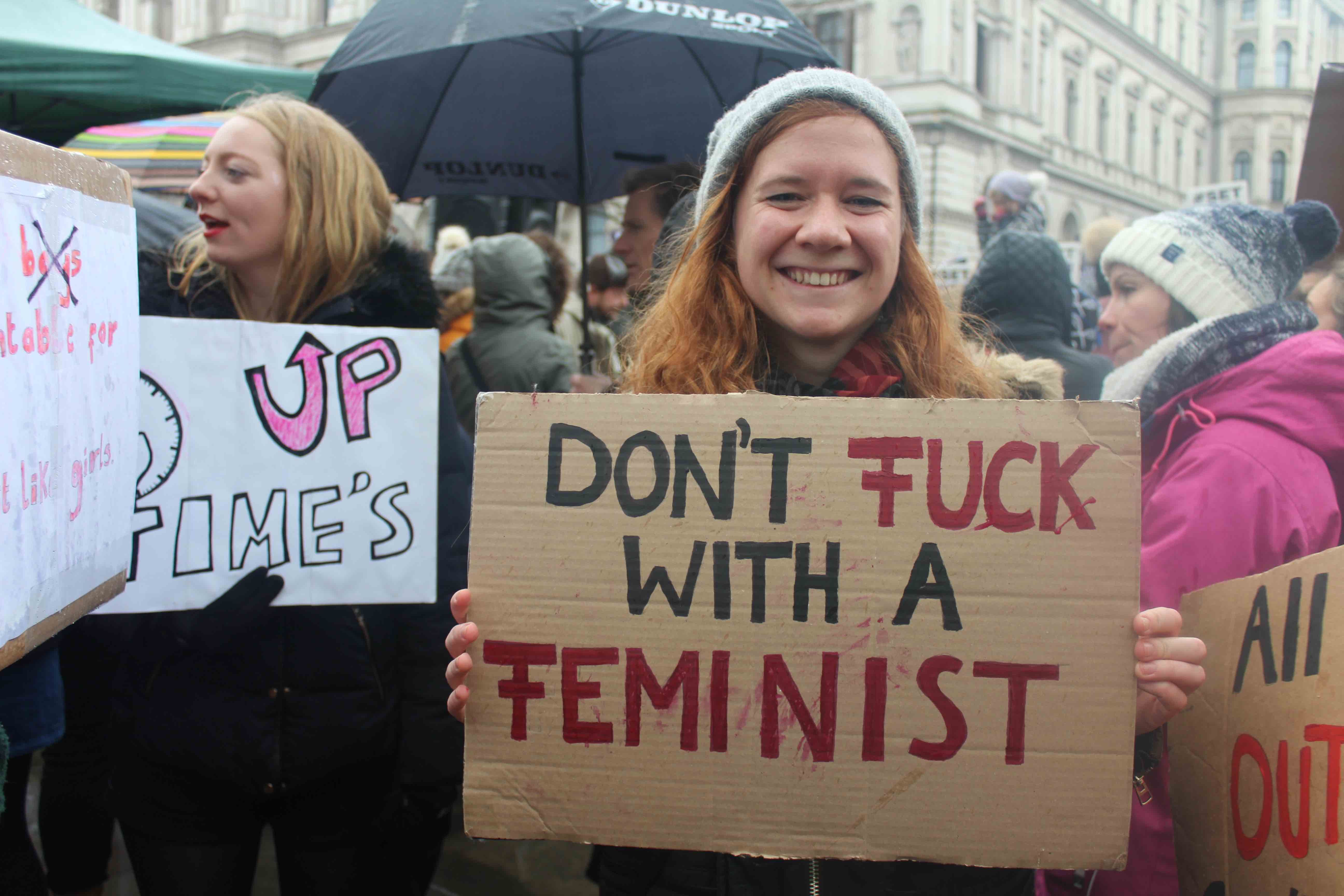 Image may contain: Text, Banner, Parade, Crowd, Umbrella, Canopy, Person, People, Human