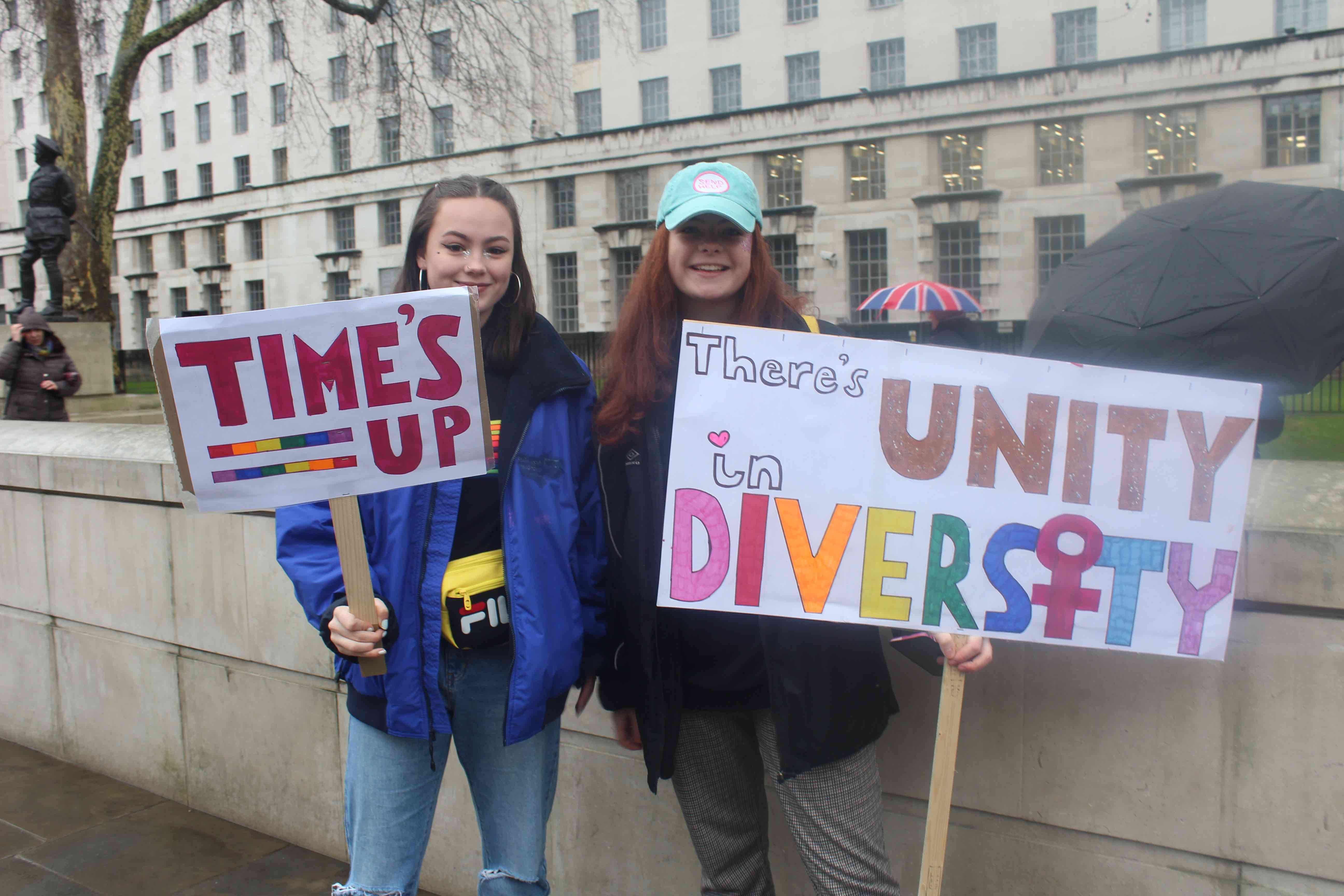 Image may contain: Umbrella, Canopy, Crowd, Text, Banner, Person, People, Human