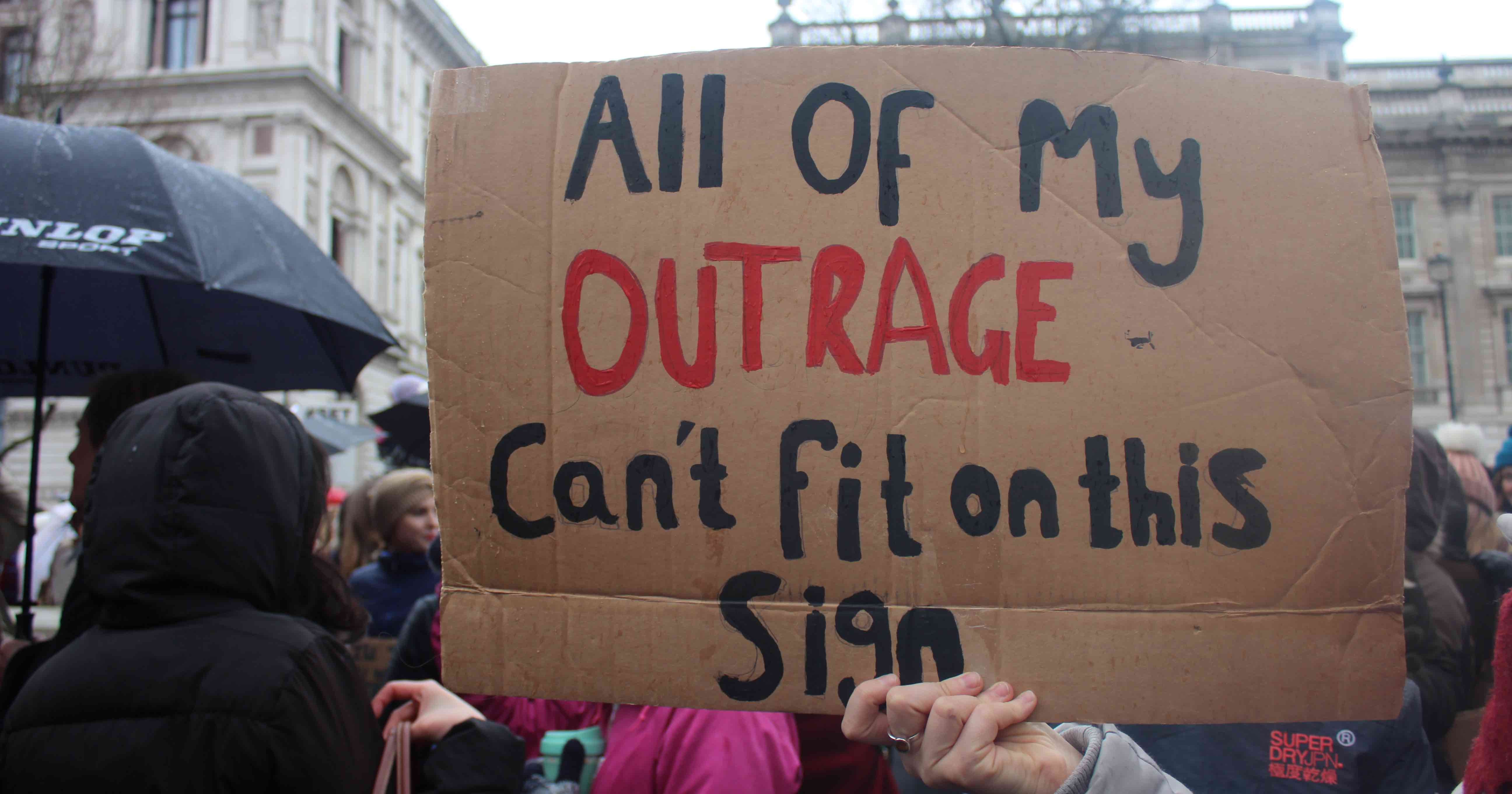 Image may contain: Umbrella, Canopy, Text, Banner, Crowd, Person, People, Human