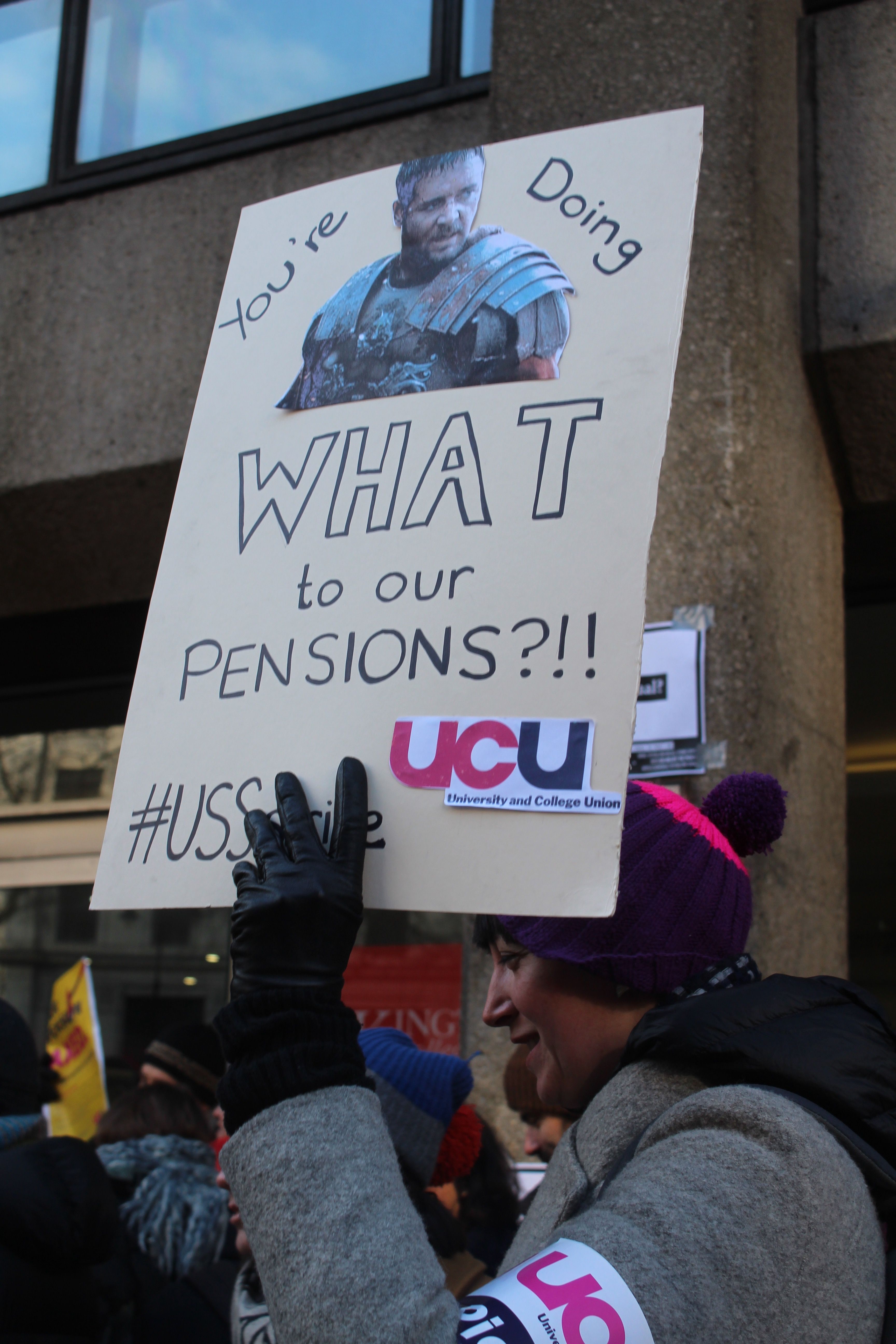 Image may contain: Billboard, Crowd, Text, Banner, Person, People, Human