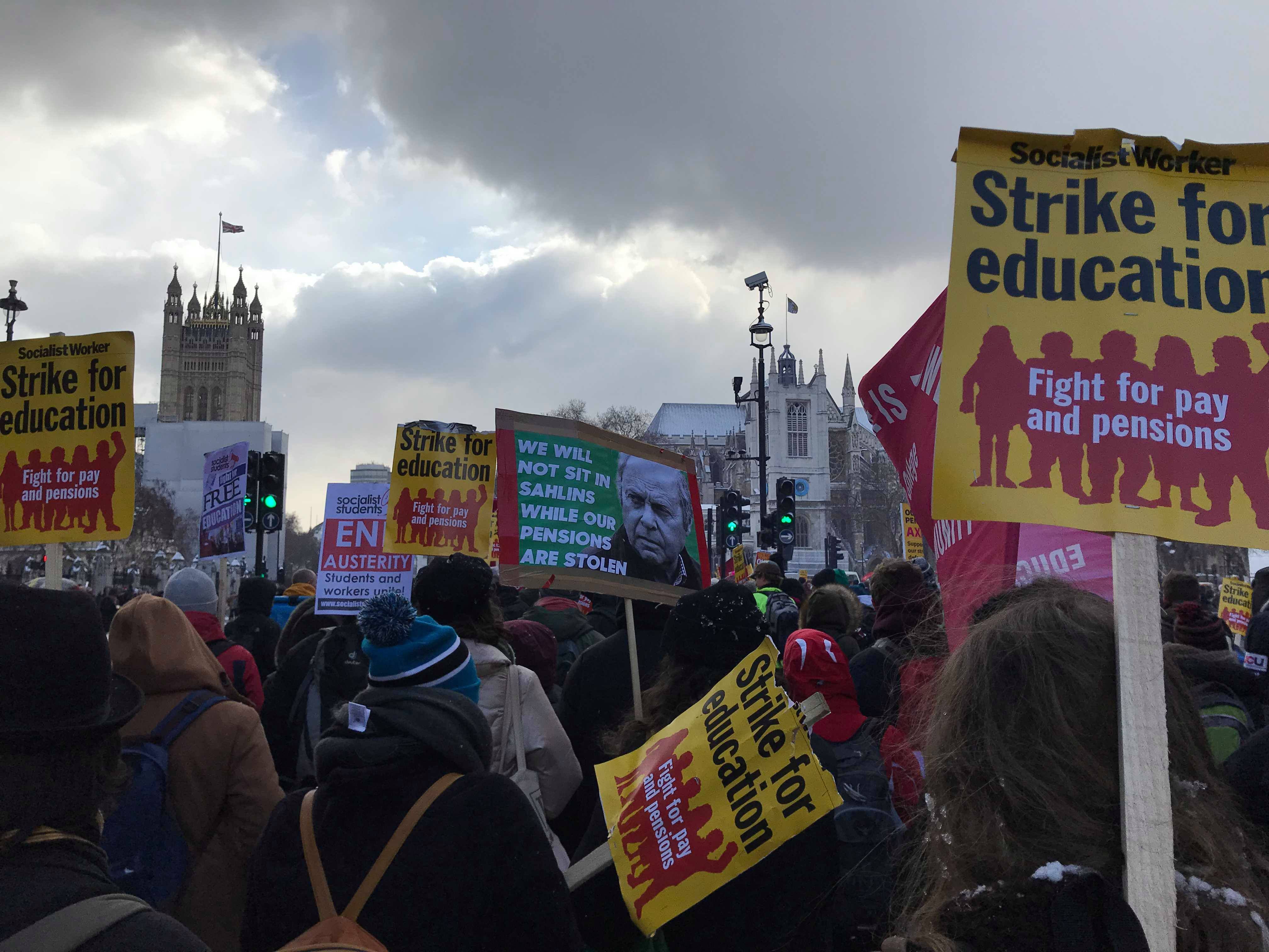 Image may contain: Text, Banner, Person, Parade, Human, Crowd