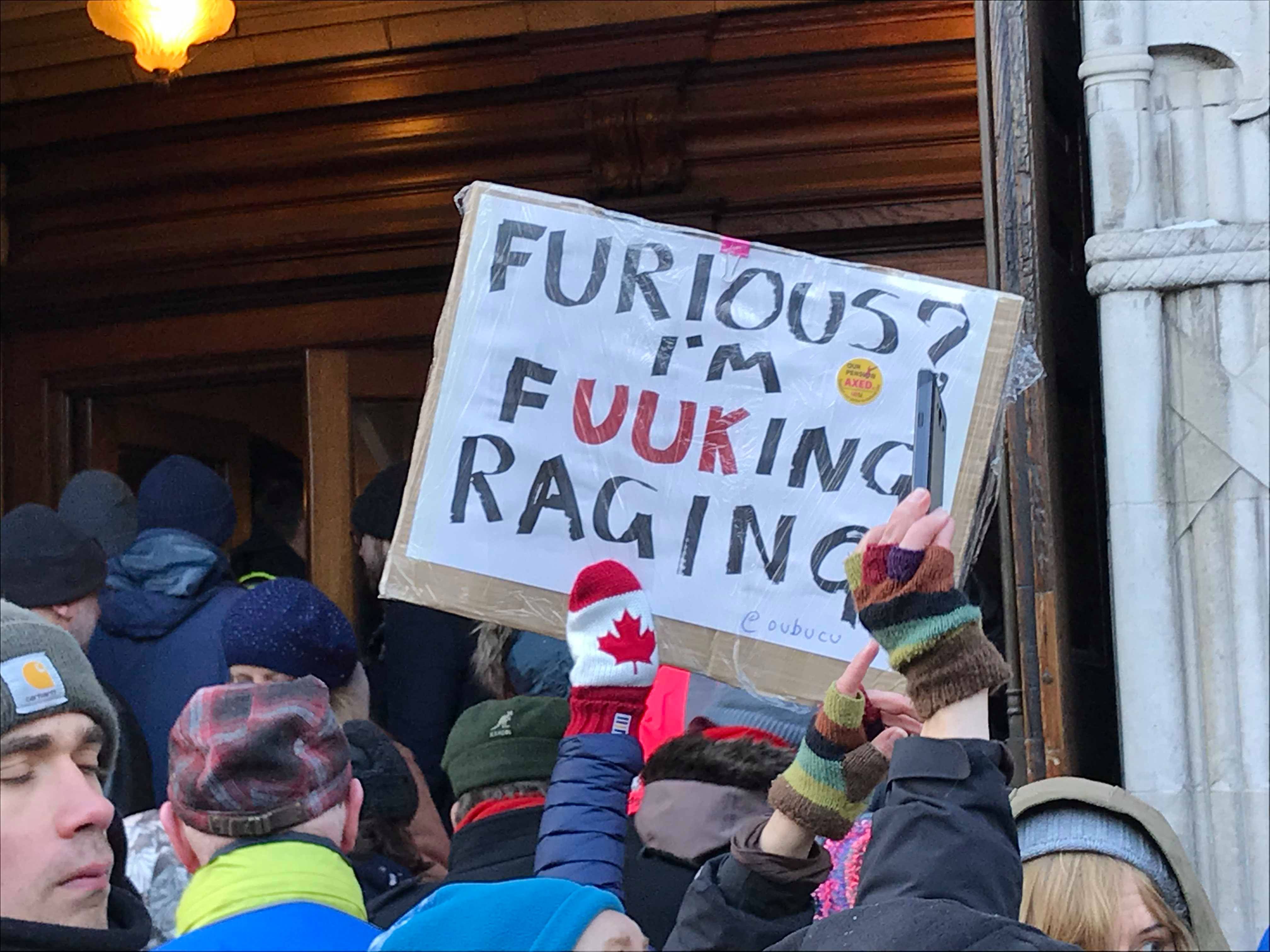 Image may contain: Text, Banner, Pillar, Column, Building, Architecture, Knitting, Crowd, Person, People, Human
