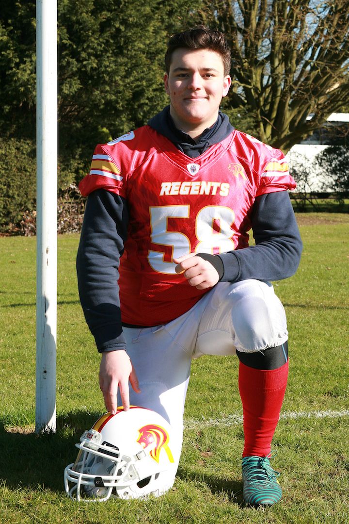 Image may contain: Pole, Soccer, Team Sport, Team, Sports, Sport, Helmet, Hardhat, Football Helmet, Football, Crash Helmet, Clothing, American Football, Person, People, Human