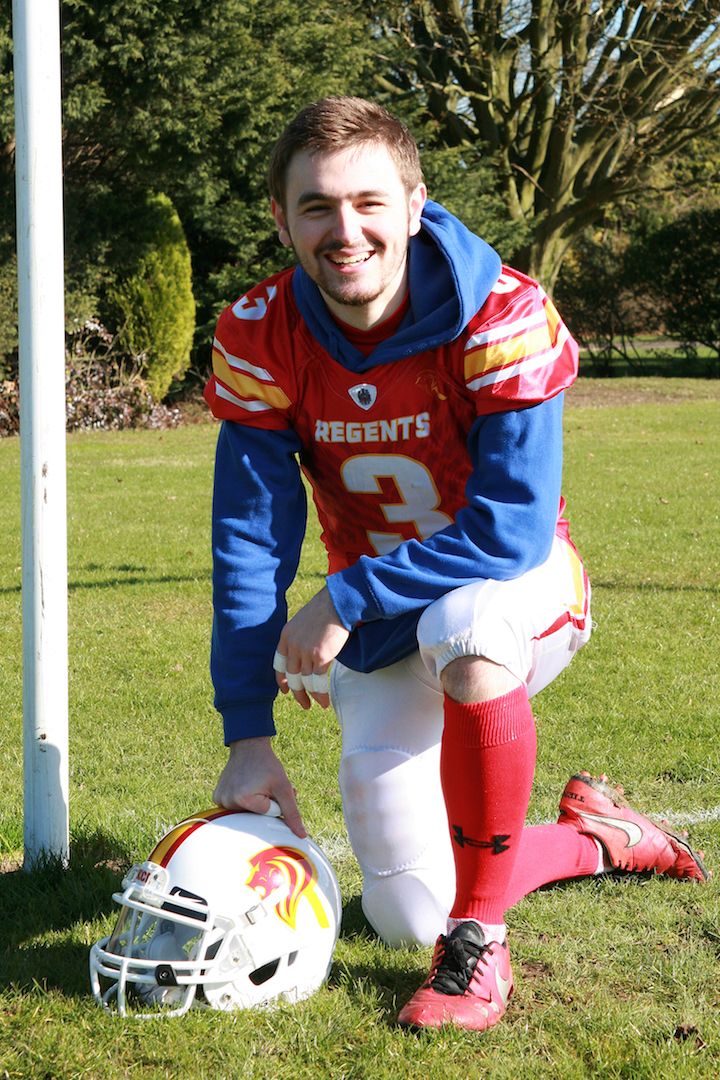 Image may contain: Soccer Ball, Yew, Tree, Plant, Flora, Conifer, Helmet, Hardhat, Football Helmet, Crash Helmet, Clothing, American Football, Sphere, Ball, Team Sport, Team, Sports, Sport, Soccer, Football, Person, People, Human