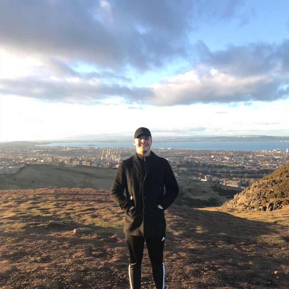 Image may contain: Jacket, Plateau, Standing, Mountain, Coat, Human, Person, Nature, Clothing, Apparel, Outdoors