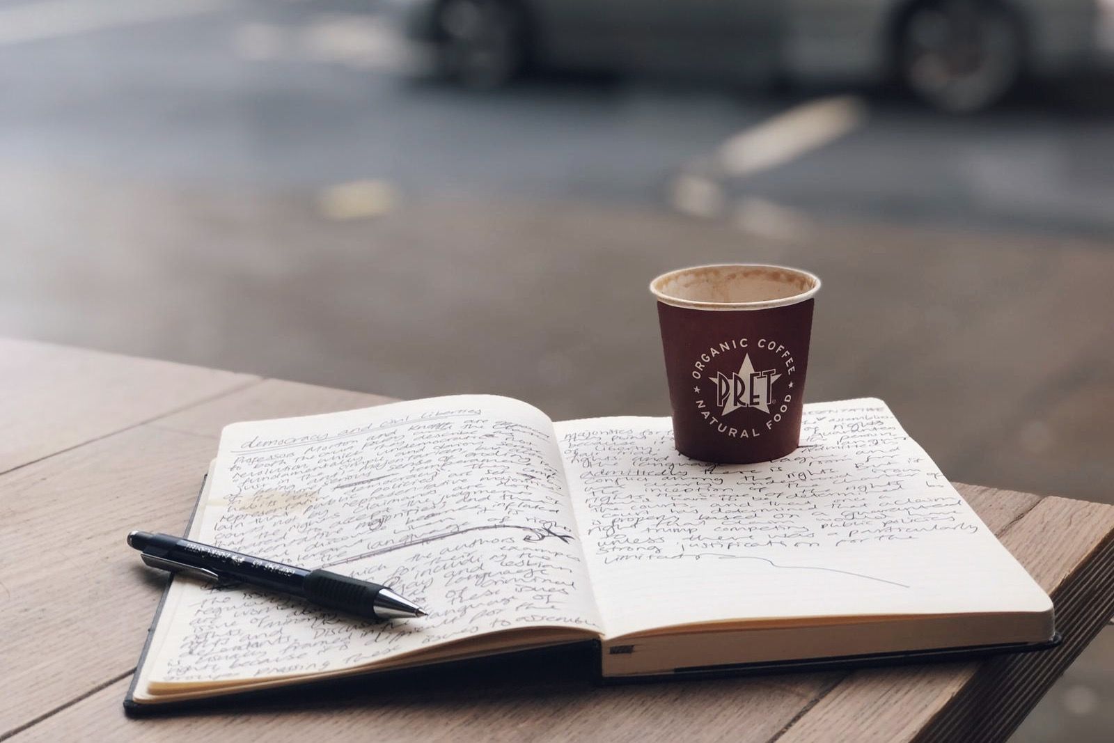Image may contain: Page, Car, Vehicle, Transportation, Automobile, Text, Cup, Coffee Cup, Book