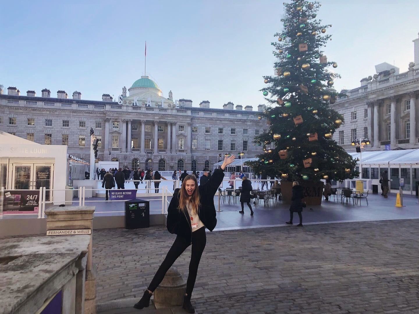 Image may contain: Fir, Abies, Pedestrian, Plaza, Town Square, Path, Walkway, Metropolis, Christmas Tree, Ornament, Footwear, Apparel, Clothing, Shoe, Plant, Tree, Human, Person, Architecture, Urban, Downtown, City, Building, Town