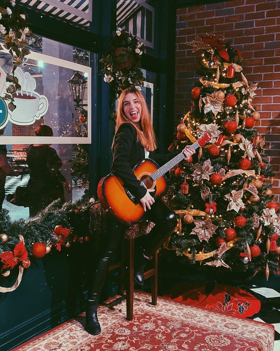 Image may contain: Musical Instrument, Guitar, Leisure Activities, Person, Human, Christmas Tree, Ornament, Tree, Plant