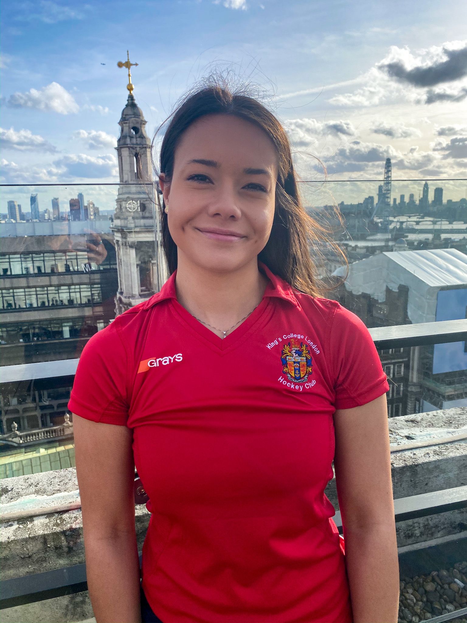 Image may contain: Face, Female, Architecture, Building, Tower, T-Shirt, Person, Human, Sleeve, Apparel, Clothing