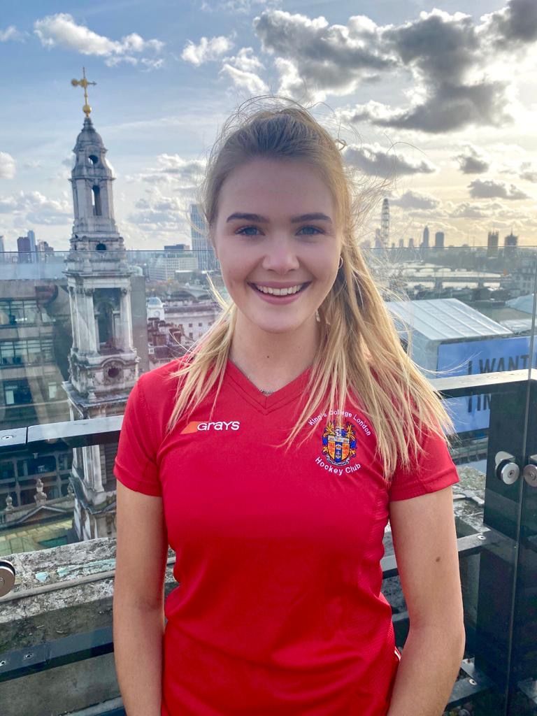 Image may contain: Portrait, Photography, Photo, Tower, Architecture, Town, Urban, Metropolis, City, Building, Teen, Blonde, Girl, Kid, Child, Woman, Face, Smile, Female, Person, Human, Clothing, Apparel