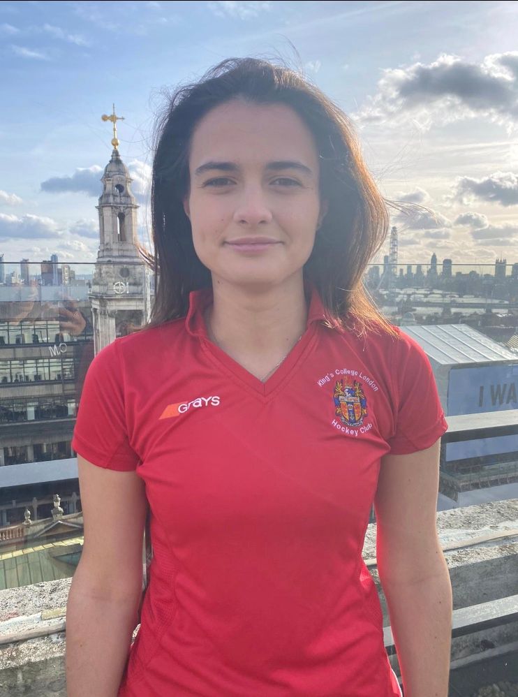 Image may contain: T-Shirt, Spire, Steeple, Girl, Tower, Face, Building, Architecture, Female, Human, Person, Apparel, Clothing
