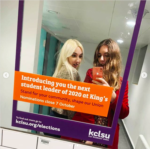 Mirror selfie of two young women in the Guy's Bar bathroom