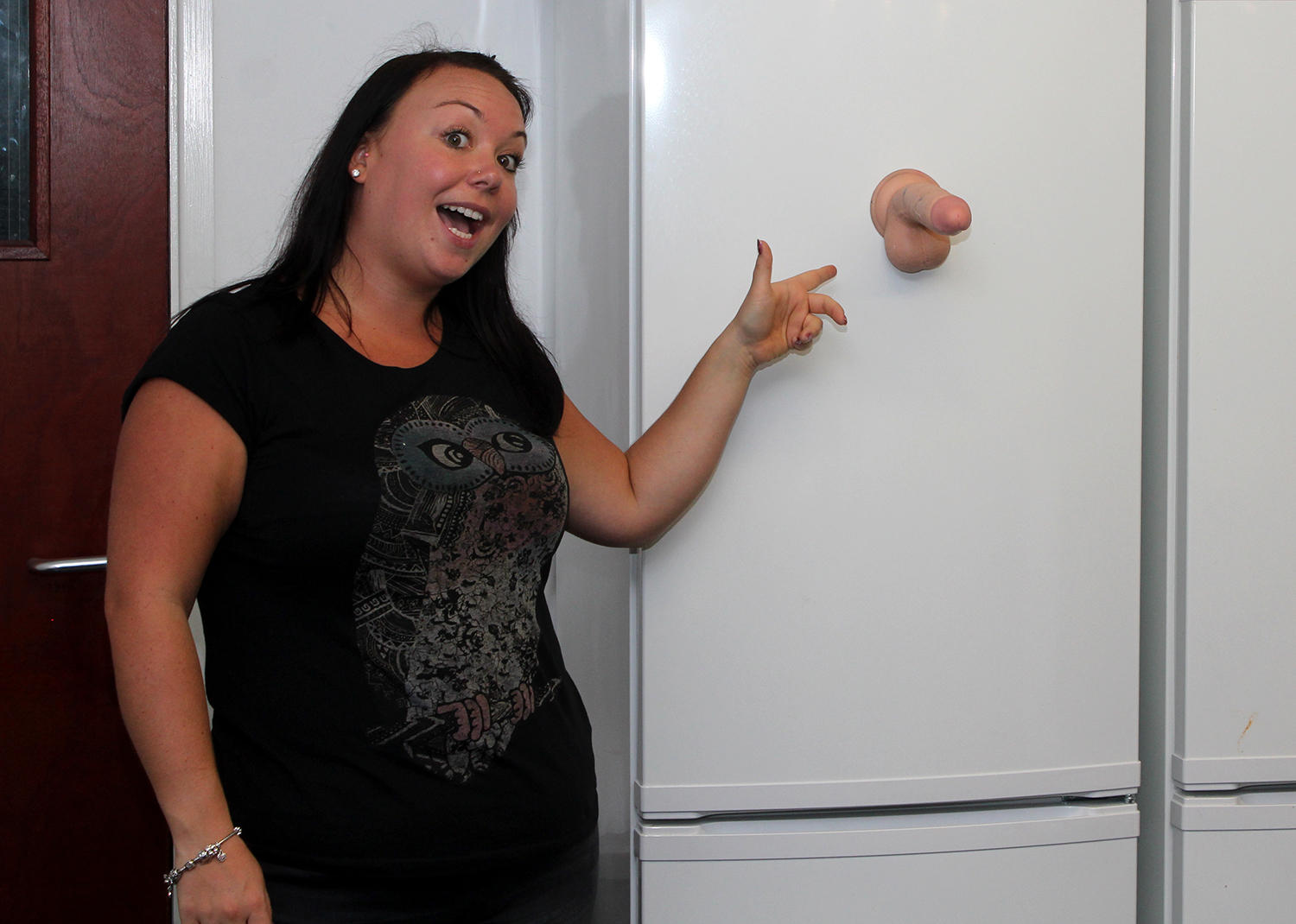 Louise demonstrating Mr. Tom's gravity-defying abilities.