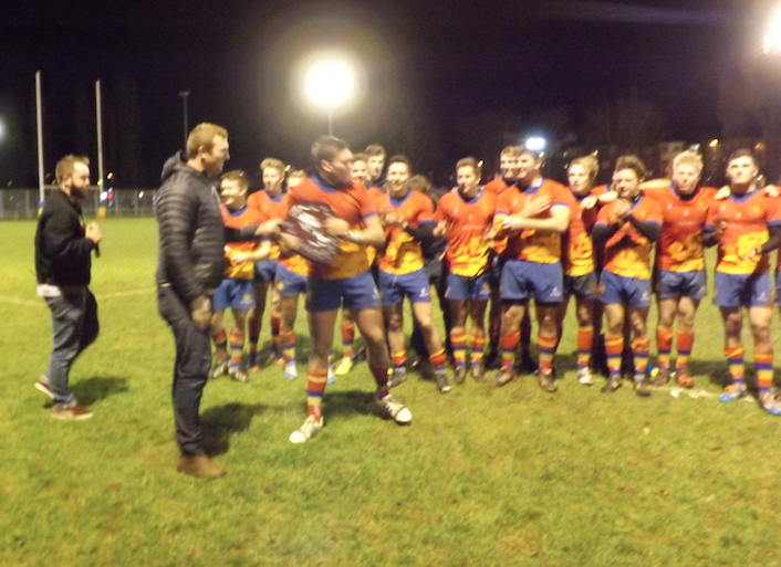 Captain Jake Knowles lifts the silver wear 