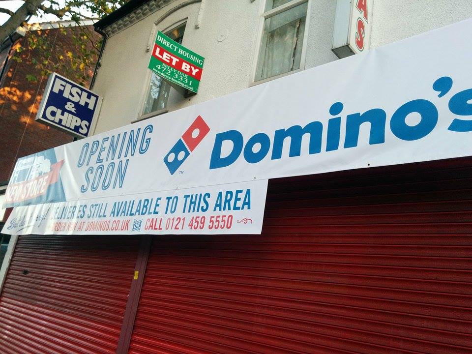 The surprise sign announcing Domino's arrival