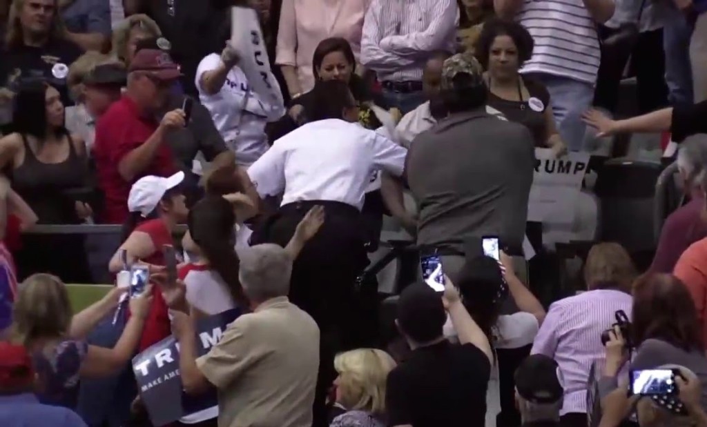 Man beaten at Trump rally for having a sign that was entitled "Trump: Bad for America"