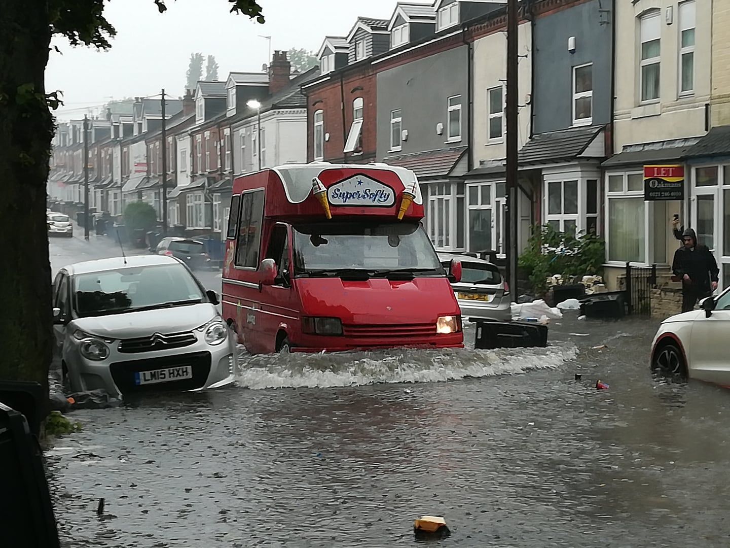 Image may contain: Vehicle, Van, Transportation, Nature, Flood