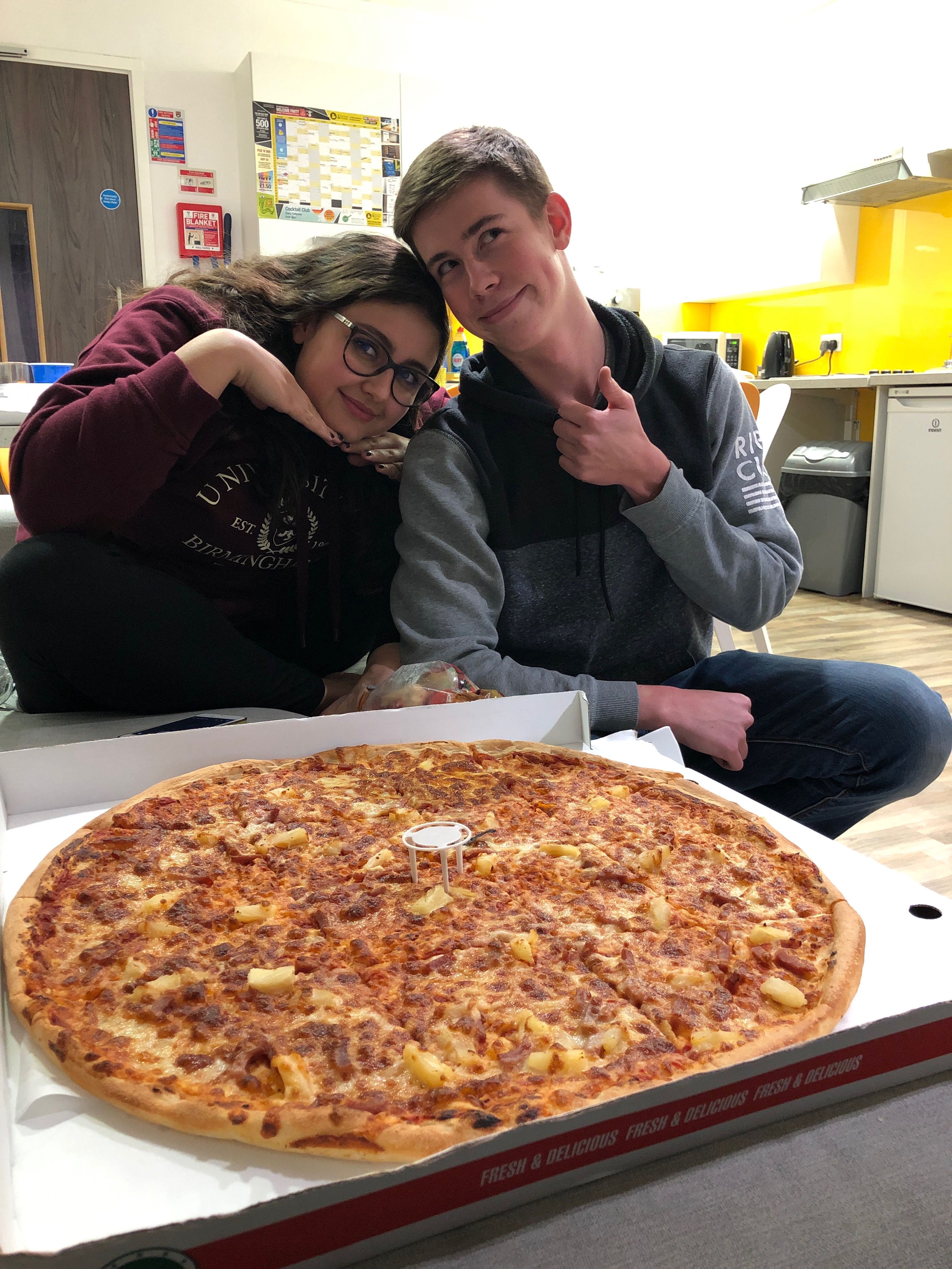 Image may contain: Pizza, Food, Person, People, Human