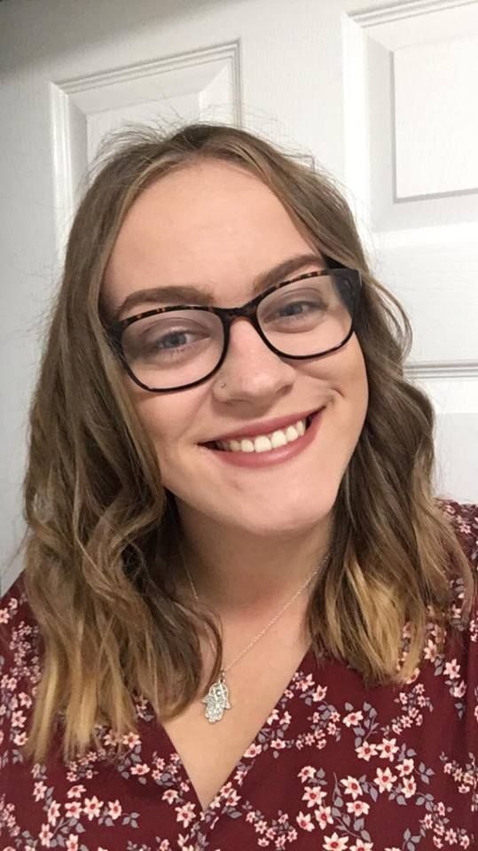 Image may contain: Photo, Photography, Portrait, Female, Smile, Face, Human, Person, Accessories, Accessory, Glasses