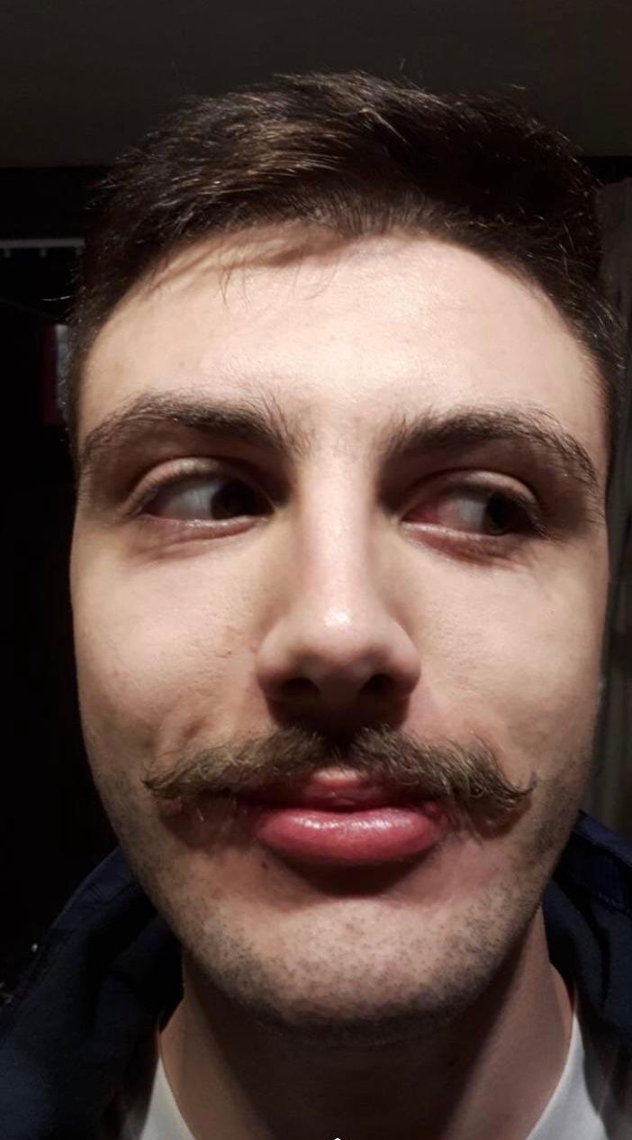Image may contain: Photo, Portrait, Photography, Mustache, Human, Face, Person