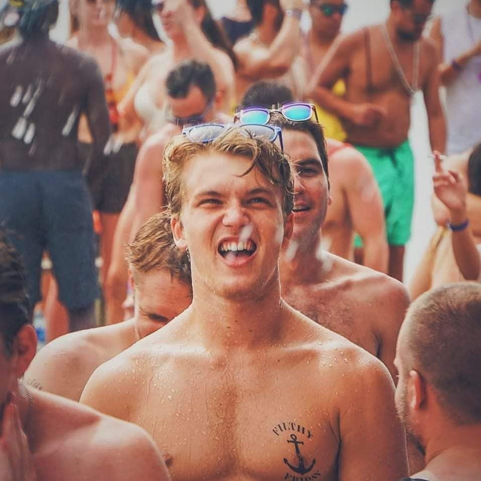 Image may contain: Crowd, Tattoo, Sunglasses, Accessory, Accessories, Spring Break, Tourist, Vacation, Skin, Person, Human