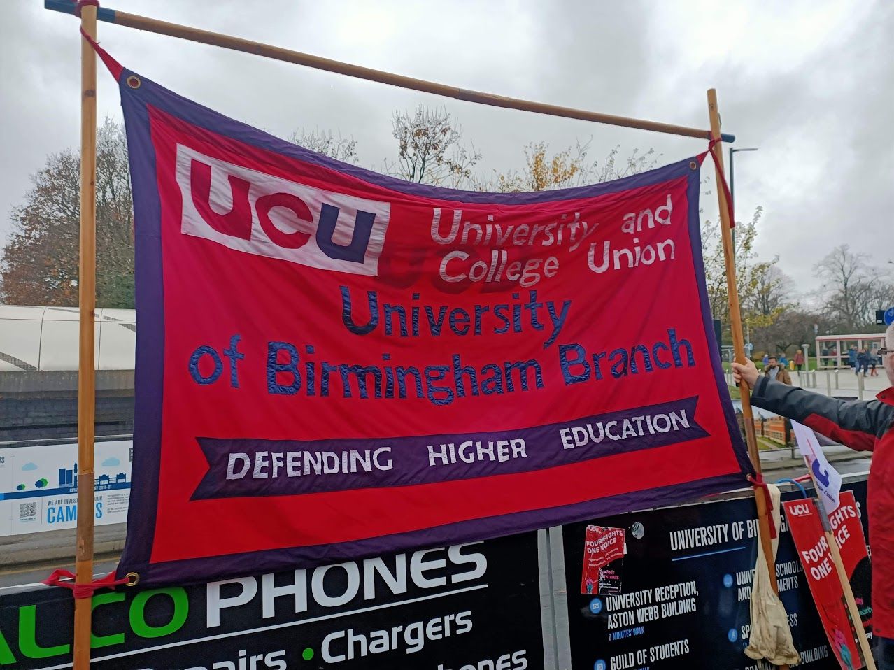 Image may contain: Person, Human, Symbol, Flag, Banner, Text