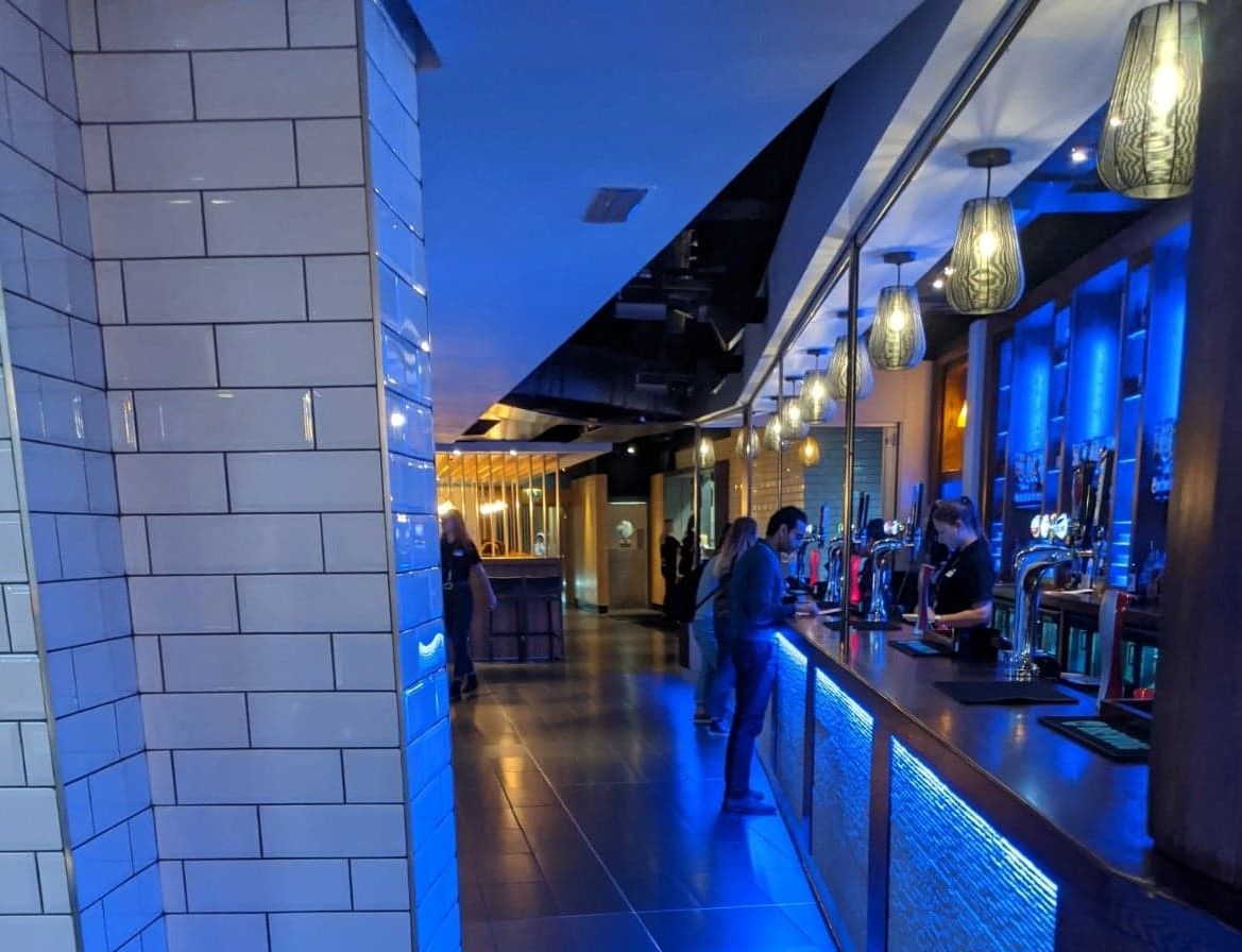 Image may contain: Bar Counter, Restaurant, Lighting, Pub, Floor, Flooring, Person, Human