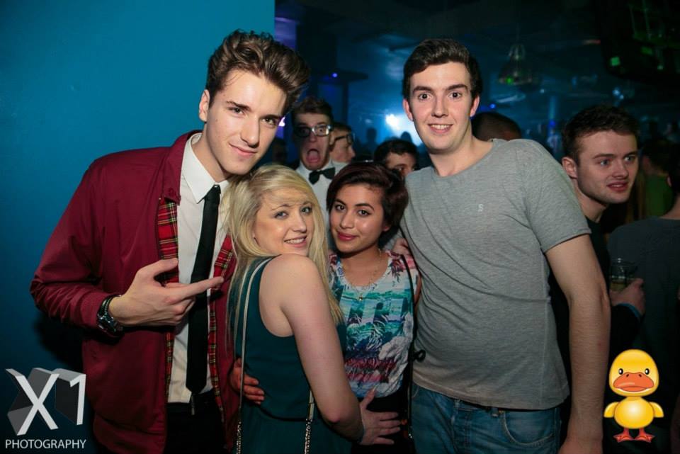 The guy in tie and and red Harrington jacket looks sauve