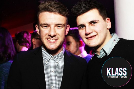 This guy in a black blazer and check shirt pulls off smart casual