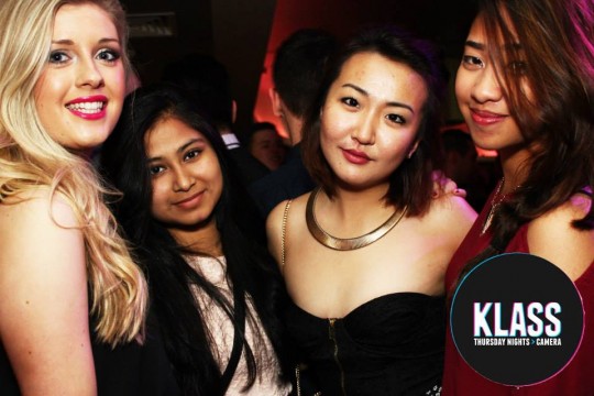 This girl looks demure in a crop top and statement neckwear