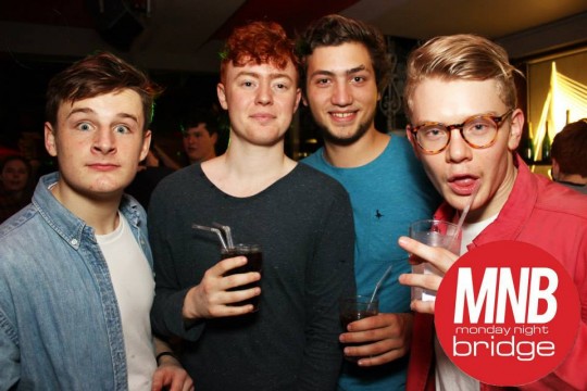 This guy wins edgy points in a red jacket and tortoise shell specs