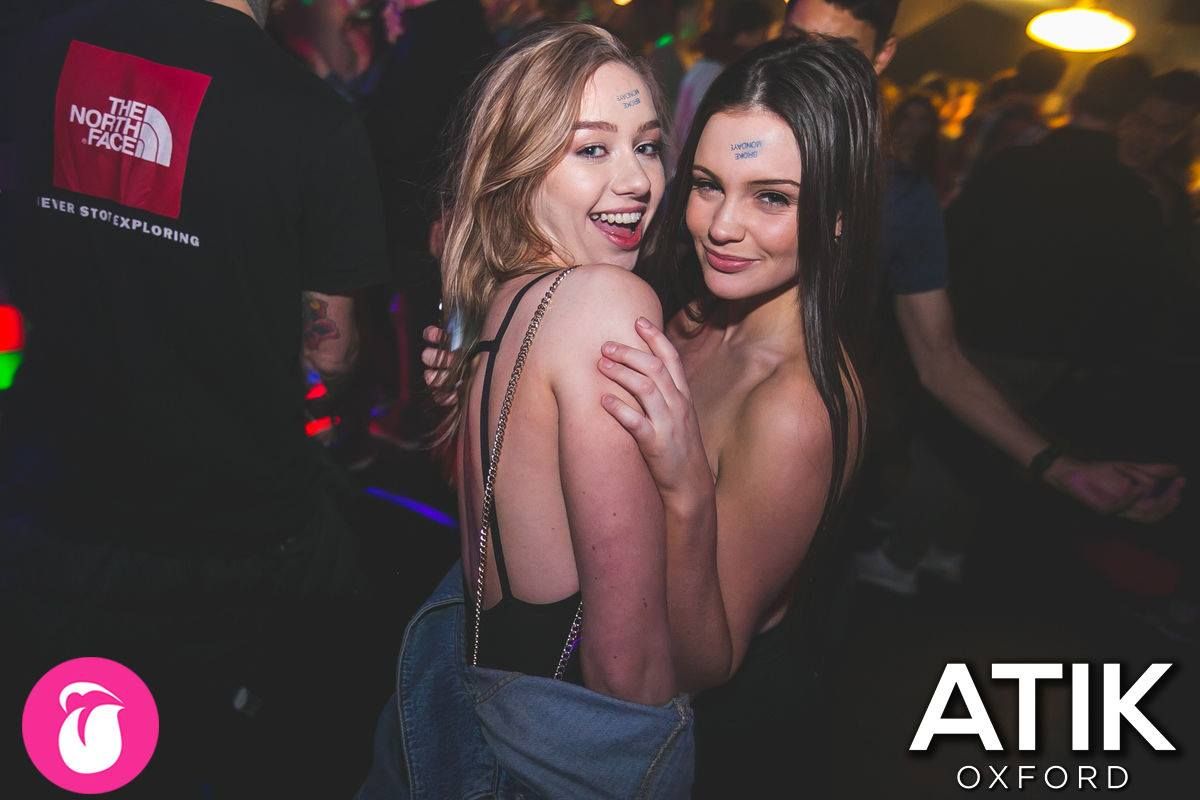Image may contain: Night Life, Night Club, Club, Poster, Music, Leisure Activities, Shirt, Clothing, Person, People, Human