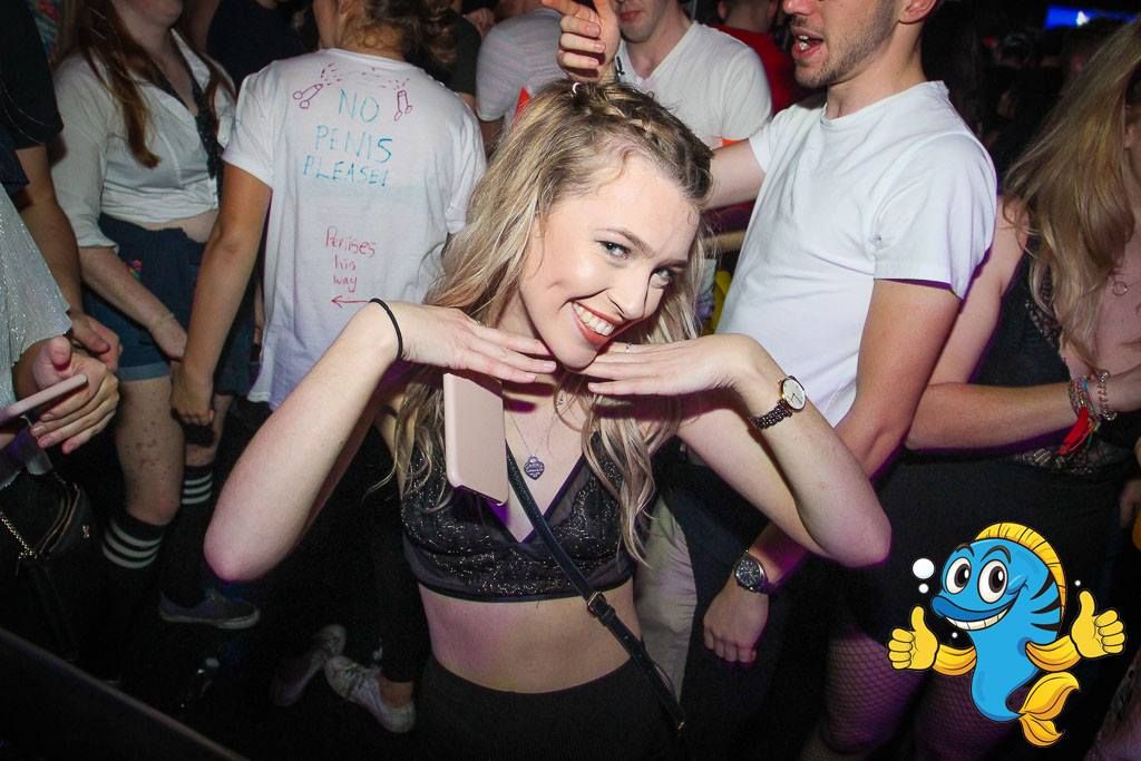 Image may contain: Party, Apparel, Clothing, Leisure Activities, Pub, Bar Counter, Skin, Night Club, Night Life, Club, Person, Human