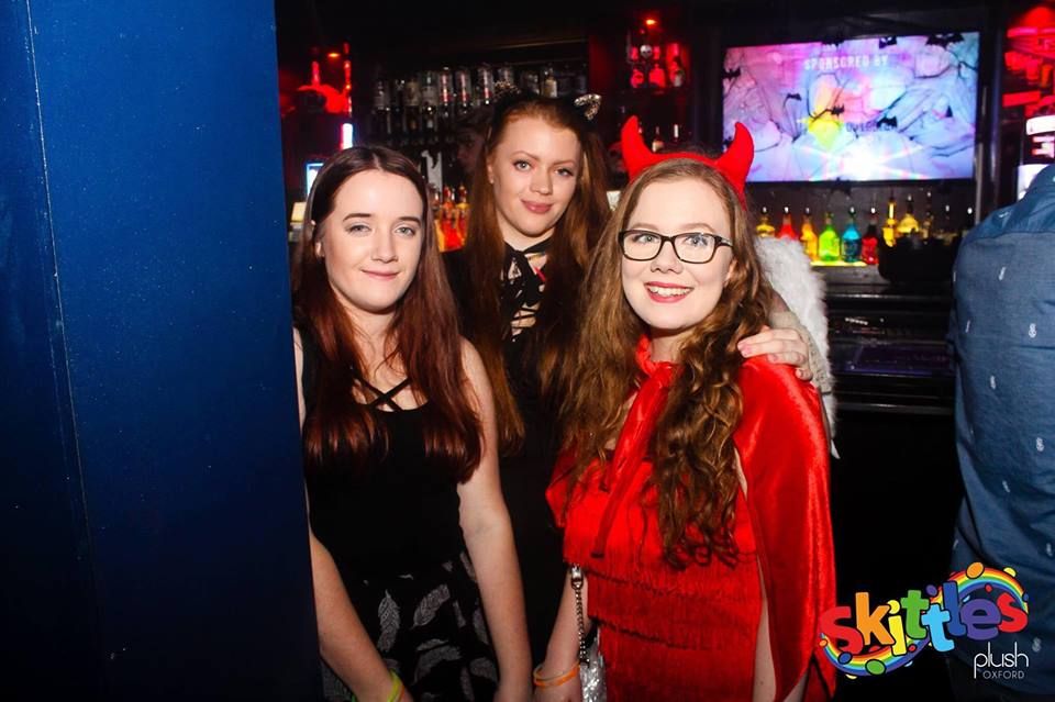 Image may contain: People, Screen, Display, Monitor, Electronics, Party, Face, Clothing, Apparel, Bar Counter, Pub, Night Club, Club, Night Life, Accessory, Accessories, Glasses, Human, Person