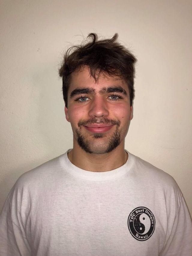 Image may contain: Portrait, Photography, Photo, Beard, Smile, Man, Apparel, Clothing, Human, Person, Face