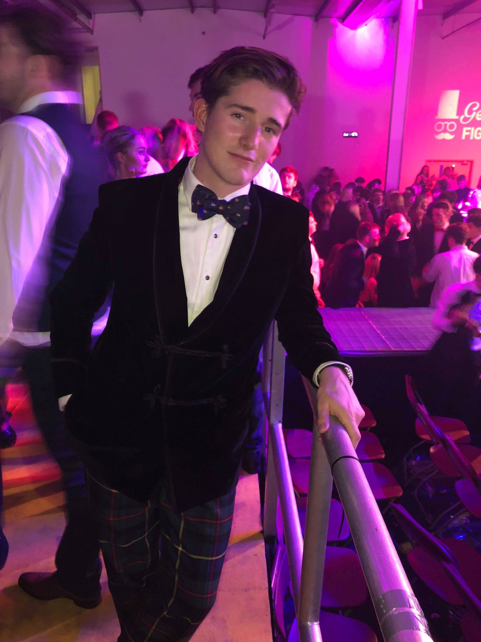 Image may contain: Tartan, Plaid, Night Club, Overcoat, Suit, Coat, Night Life, Accessory, Accessories, Tie, Club, Clothing, Apparel, Person, Human