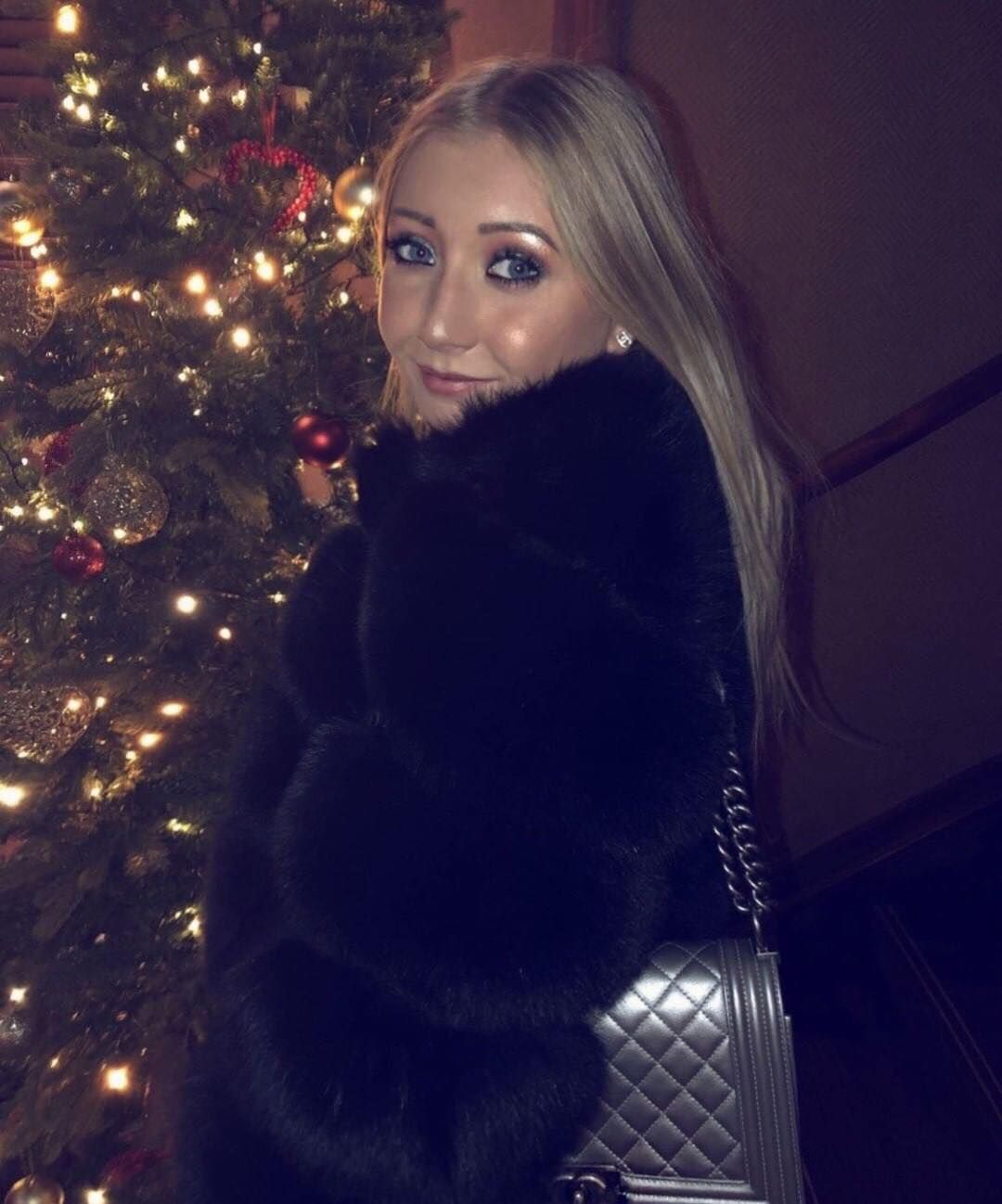 Image may contain: Fur, Ornament, Christmas Tree, Plant, Tree, Human, Person, Clothing, Apparel