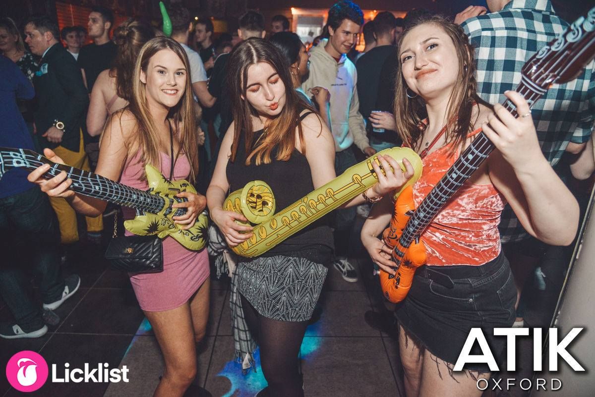 Image may contain: Disco, Musician, Guitar, Musical Instrument, Night Club, Club, Leisure Activities, Human, Person