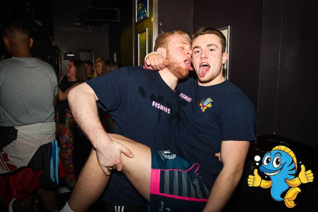 Image may contain: Pants, Club, Man, Arm, Pub, Bar Counter, Night Life, Face, Skin, Clothing, Apparel, Human, Person