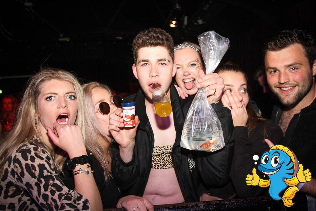 Image may contain: Drinking, Glass, Bar Counter, Pub, Beer, Alcohol, Night Life, Beverage, Drink, Party, Accessories, Sunglasses, Accessory, Person, Human