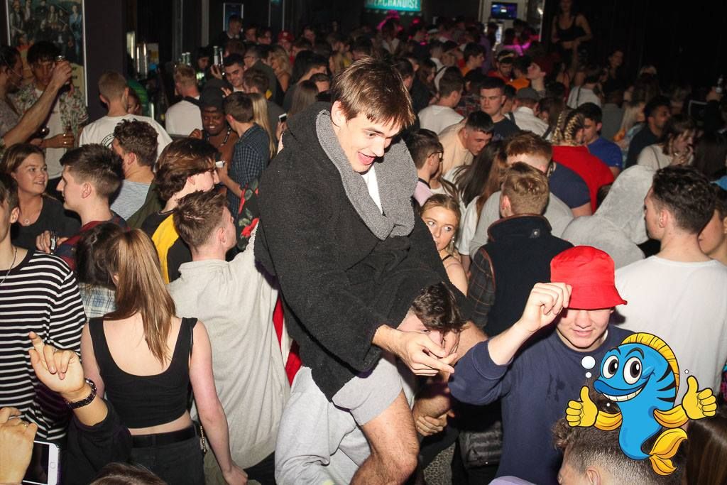 Image may contain: Pub, Hat, Apparel, Clothing, Skin, Night Club, Club, Night Life, Party, Audience, Crowd, Person, Human