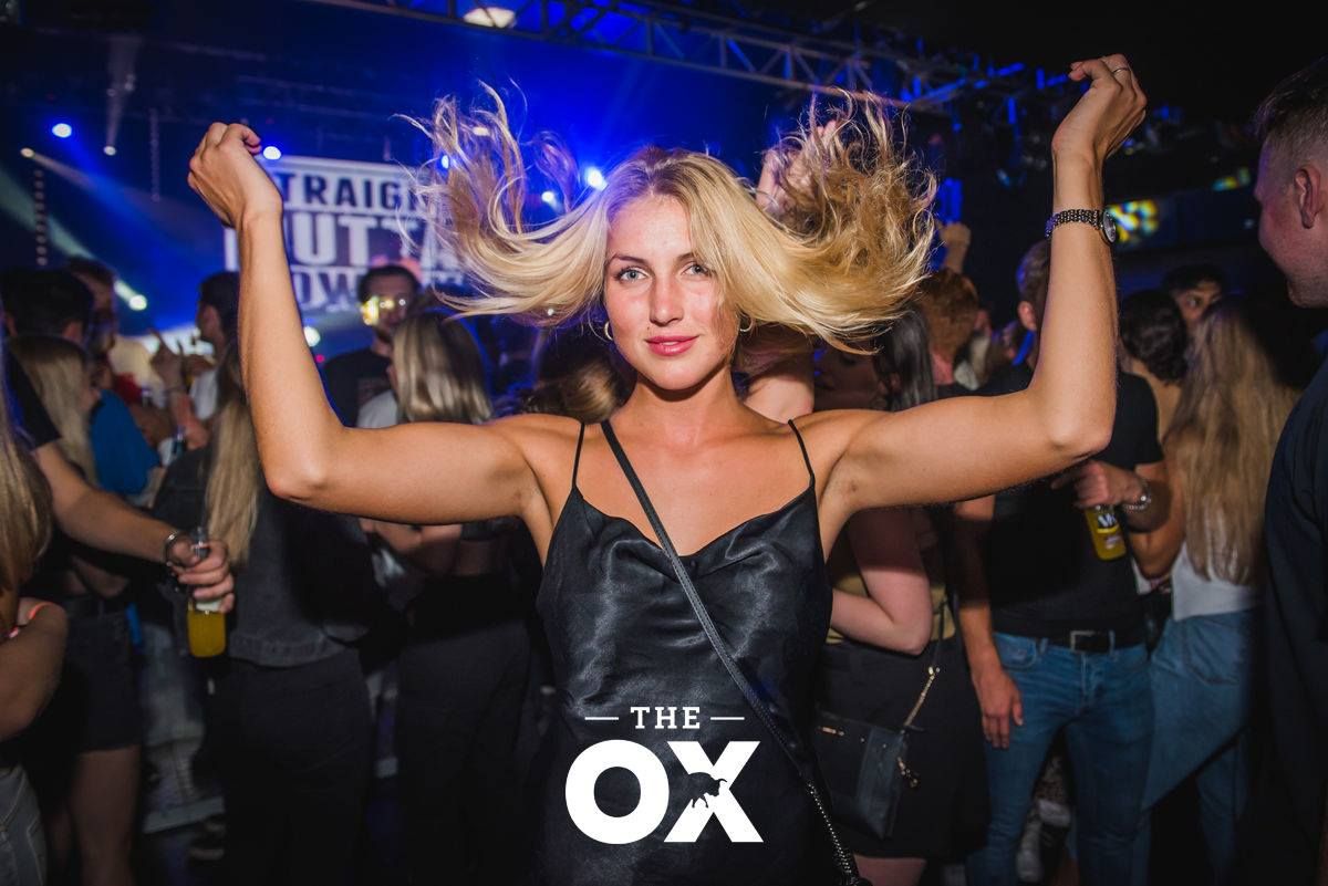 Image may contain: Disco, Night Life, Party, Denim, Jeans, Pants, Clothing, Apparel, Night Club, Club, Human, Person