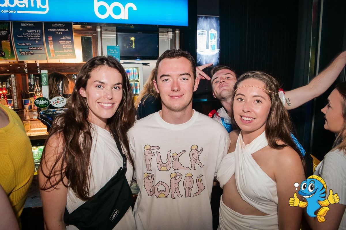 Image may contain: Night Life, Bar Counter, Sleeve, Club, Pub, Clothing, Apparel, Human, Person