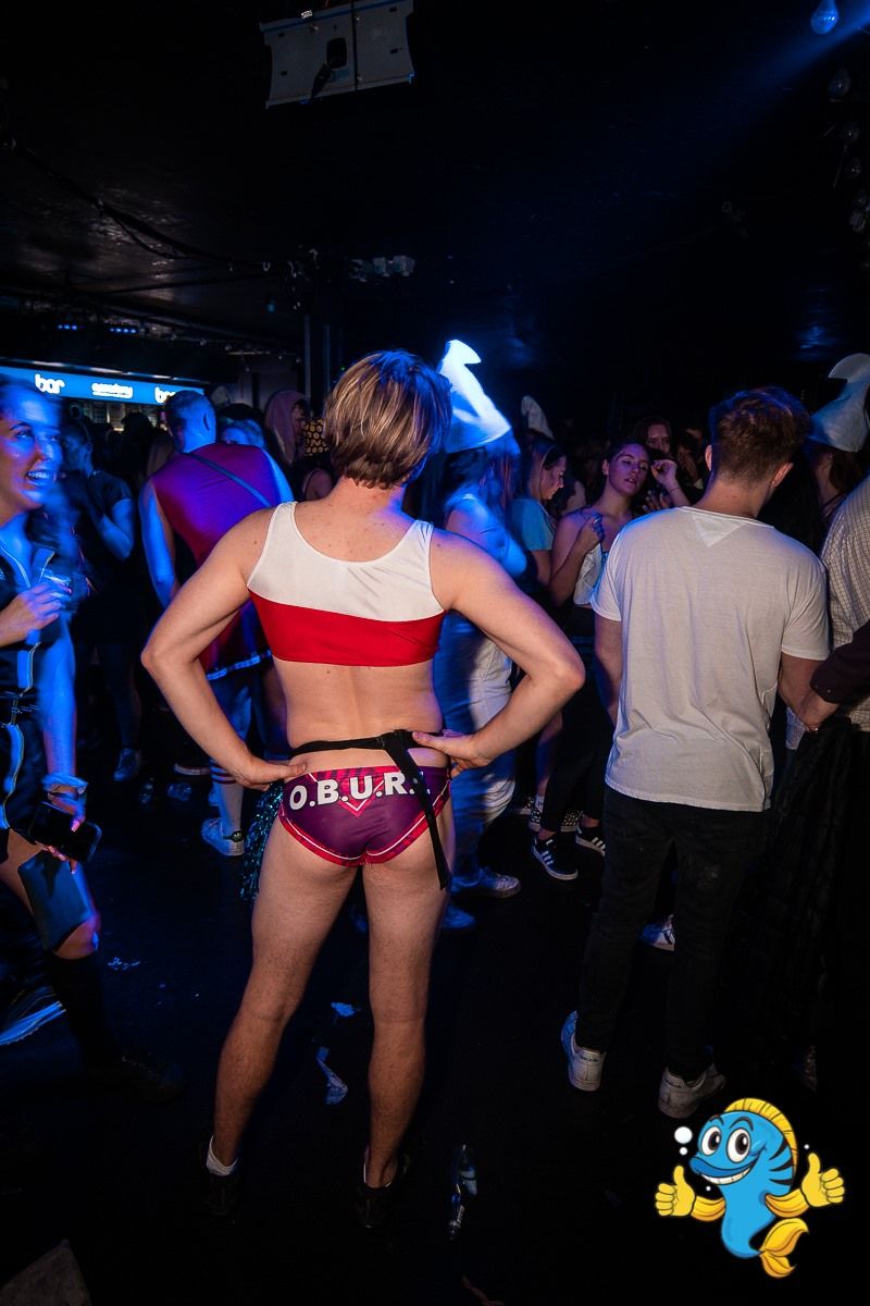Image may contain: Disco, Night Life, Underwear, Lingerie, Back, Party, Shoe, Footwear, Clothing, Apparel, Night Club, Club, Human, Person
