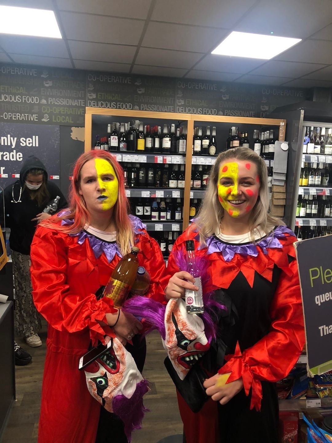 Image may contain: Halloween, Liquor, Alcohol, Hair, Drink, Beverage, Apparel, Clothing, Bar Counter, Pub, Costume, Human, Person